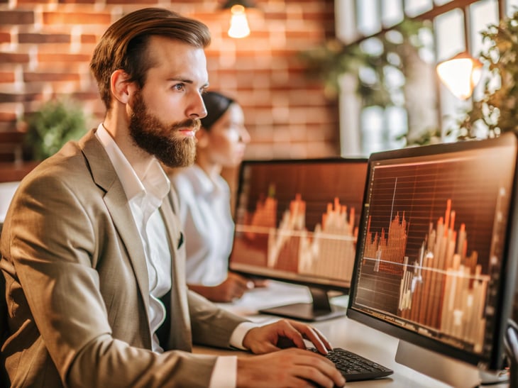 A focused individual analyzing data on multiple screens, a calm and determined expression, soft ambient lighting creating a professional atmosphere, showcasing financial growth visuals.